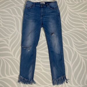 FREE PEOPLE skinny distressed jeans with fringed hem Size 28